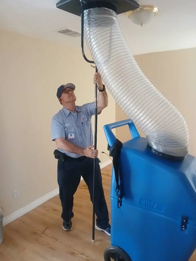 Furnace Tune-Up technician using HEPA equipment in Ventnor City